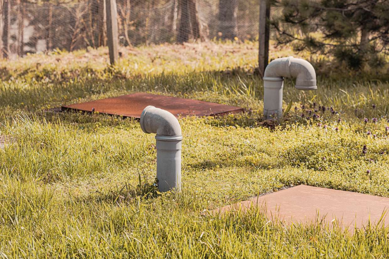 Septic Tank & Leach Field Locating/Mapping in Kingston, NY — Septic vent pipes and access covers over a leach field