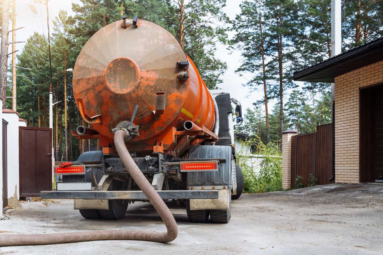 Septic pumping truck servicing a residential property in Kingston, NY