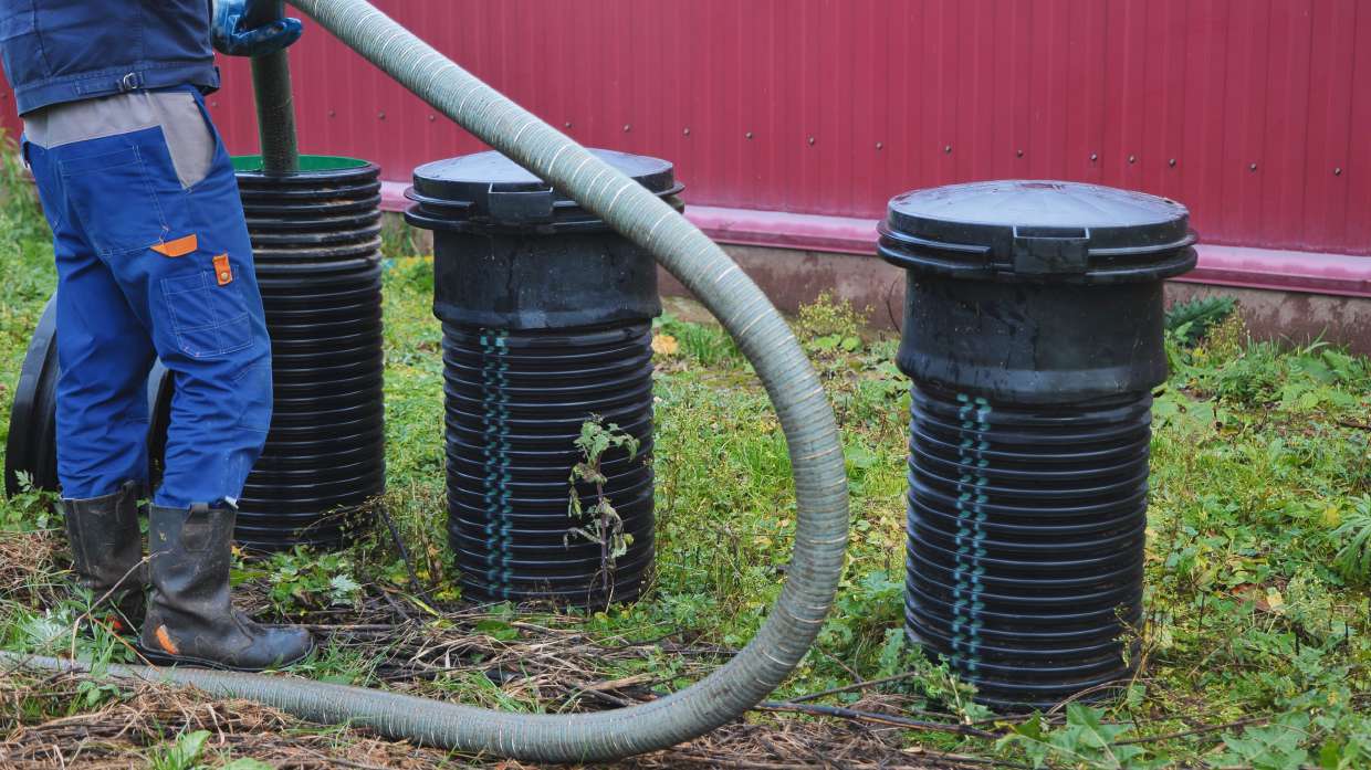 Septic risers and hose during a tank service call