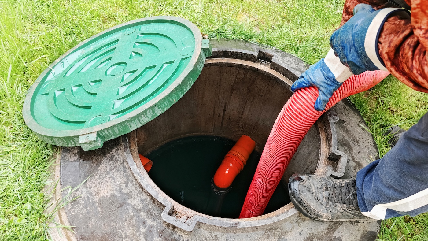 Pumping out a septic tank during an emergency service call.