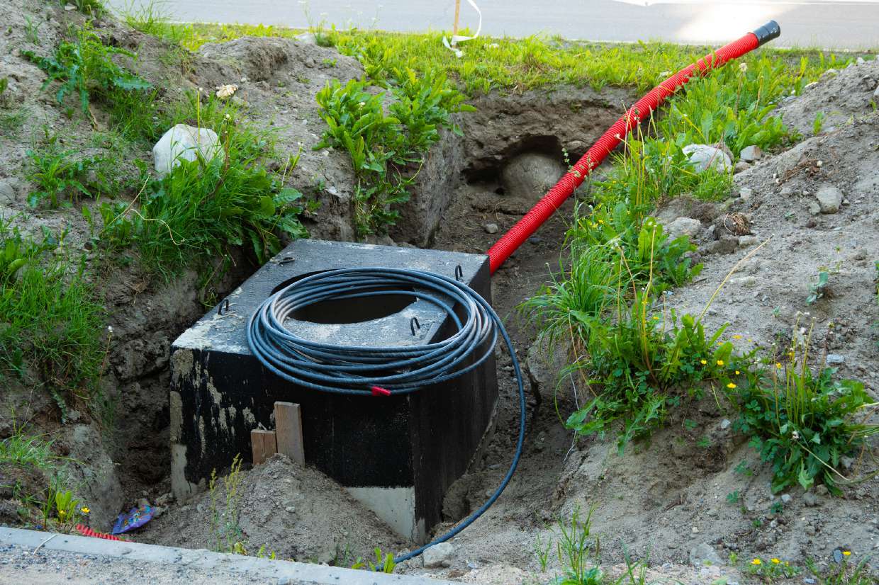 Septic Repair project in Hurley (Rolling Meadows), NY — Underground chamber with conduit during installation