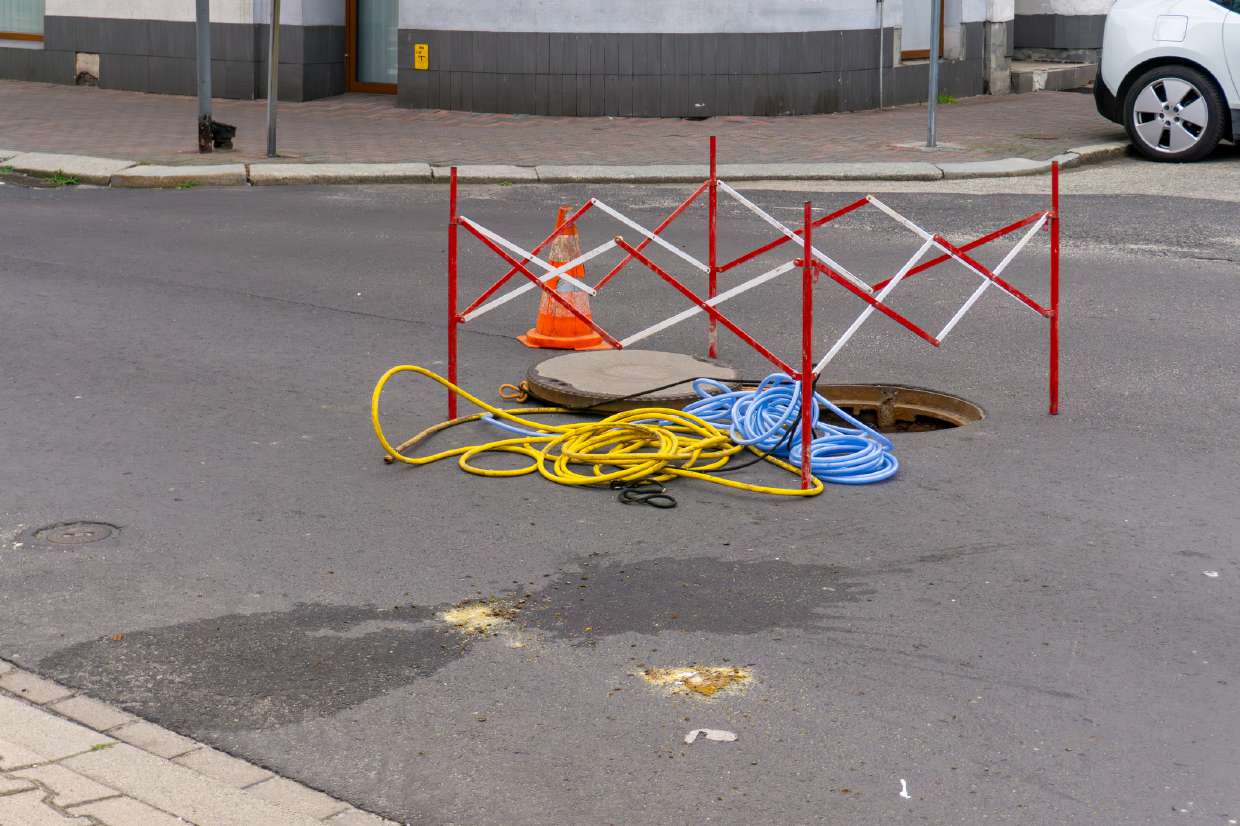 Sewer Camera Inspection project in Woodstock, NY — Barricaded work zone around an open manhole