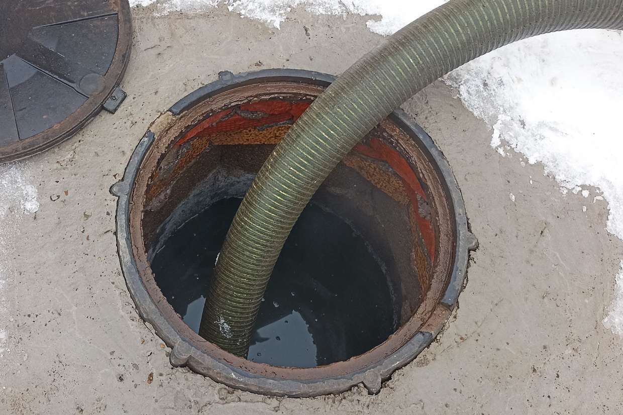 Sewer Snaking / Roto-Rooter project in Saugerties (Glasco), NY — Suction hose inserted into a septic manhole